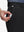 Detail view of front pocket on black flat front golf joggers pants with belt loops