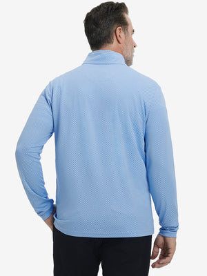 Back upper view of model wearing jacquard quarter zip pullover in light blue, showing clean seam lines.