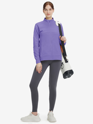 Women's Water-Resistant Stretch Fleece Lined Jacket in lavender, model holding golf bag