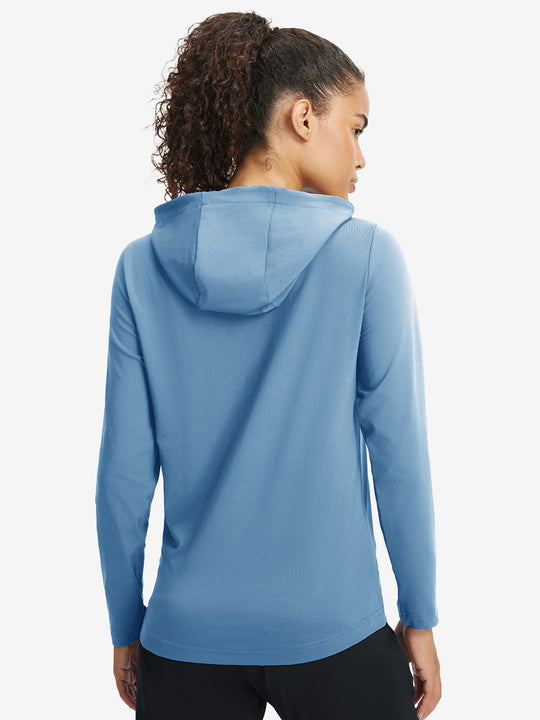 Back upper view of model in women's lightweight hoodies pullover, showing relaxed fit in misty blue.