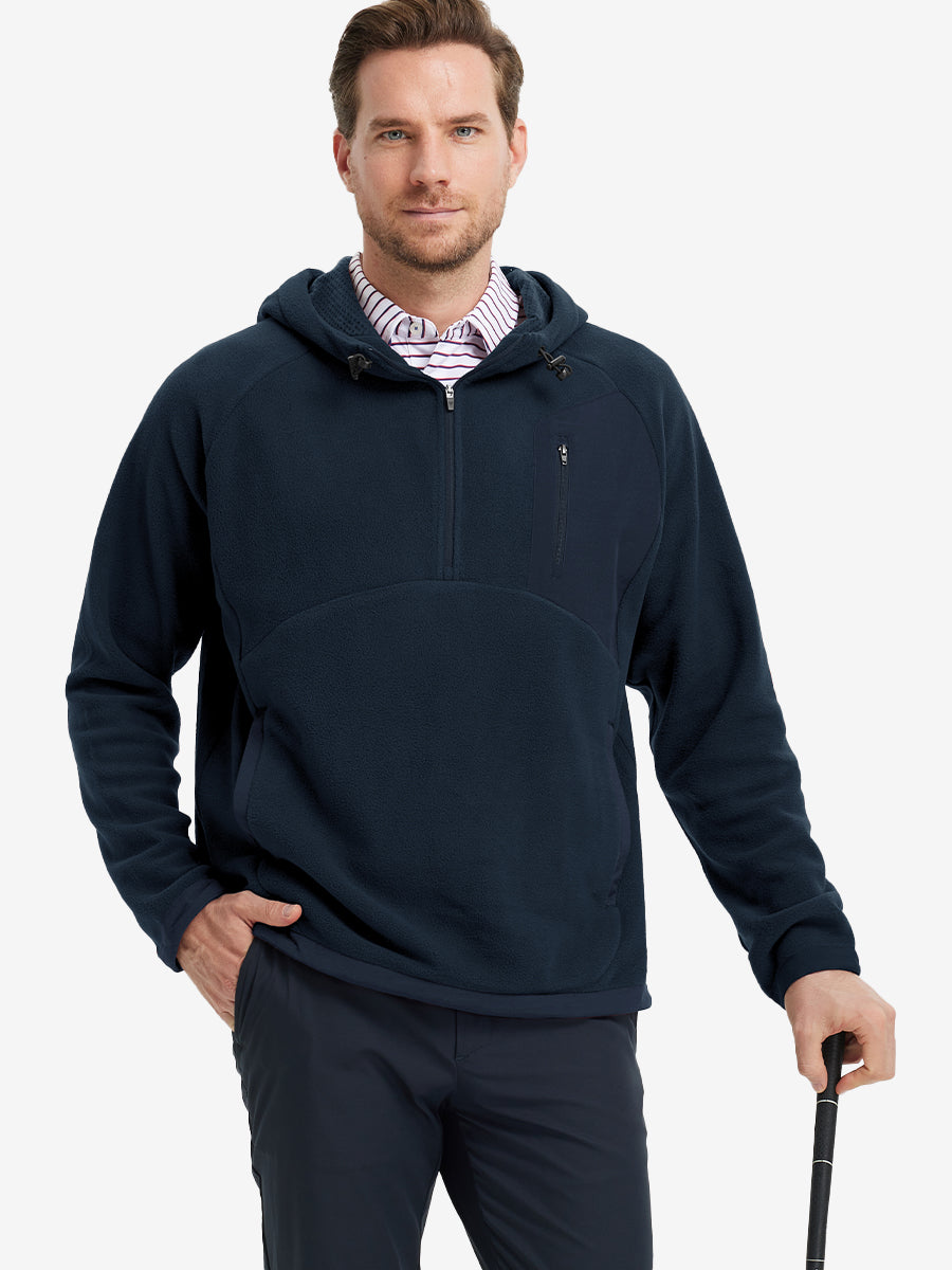 Model holding a golf club, dressed in Navy Quarter Zip Polar Fleece Sweatshirt, sporty fit.