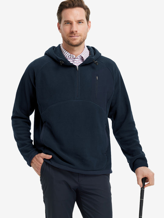 Model holding a golf club, dressed in Navy Quarter Zip Polar Fleece Sweatshirt, sporty fit.