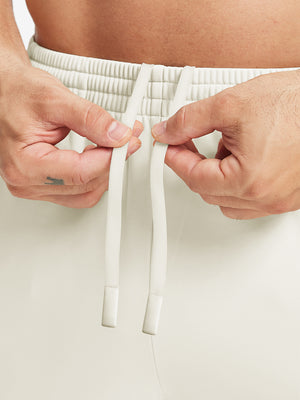 Front waistband detail of Water Resistant Comfy Fleece Golf Joggers in cream