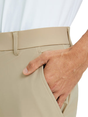 Close-up detail of one hand resting in pocket, showing relaxed fit of the khaki quick dry pants.