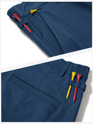 Waistband detail of lightweight flat front casual trousers in blue indigo, showing clean stitching.