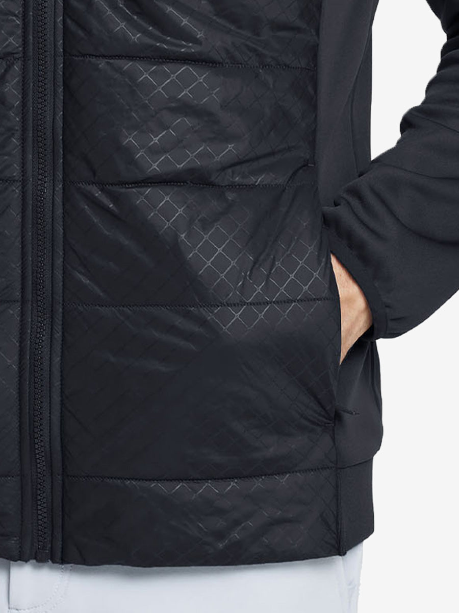 Hand in single pocket detail of the black Golf Fleece Winter Jacket, soft thermal material.
