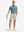 Full-body front view of model with a golf club wearing the misty blue ventilated pique performance polo on the course