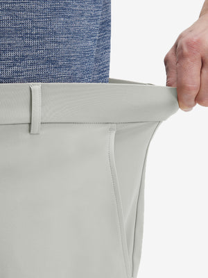 Detail view of elastic waistband on silver gray flat front golf joggers pants with belt loops
