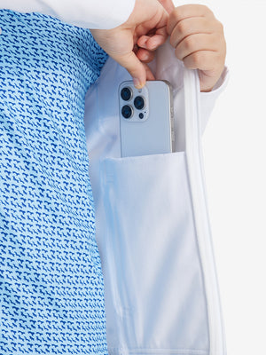 Close-up of the front side pocket detail on kids soft lightweight fleece lined jacket in white, showing quality stitching.