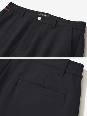 Close-up of the waistband details on black water-resistant stretch heat-tech winter trousers
