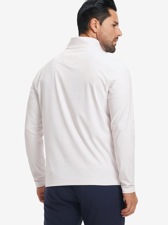 Back upper body angle of the orange line full print quarter zip pullover, model turns head slightly.