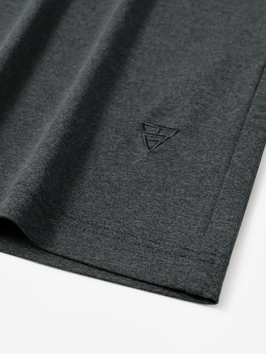 Hem detail of Men’s Long Sleeve Mock Turtleneck Shirt in Dark Grey Heather, showcasing smooth finish.