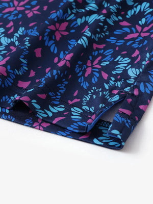 Hem slit detail of MAELREG Performance Jersey Print Polo in Navy Colorful Flower – comfort & movement