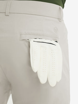 Close-up of the back pocket detail on the light khaki stretch soft flat front dress golf shorts, emphasizing storage