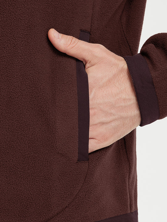 Hand in pocket detail of the Wine Red Quarter Zip Polar Fleece Sweatshirt, soft fleece fabric.