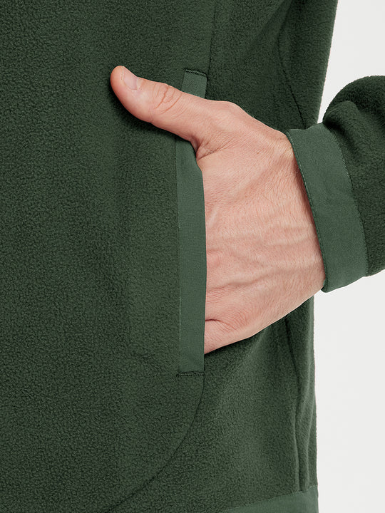 Hand in pocket detail of the Olive Green Quarter Zip Polar Fleece Sweatshirt, soft fleece fabric.