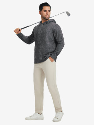 Full-body view of model in grey exclusive print kangaroo hoodies holding a golf club outdoors.