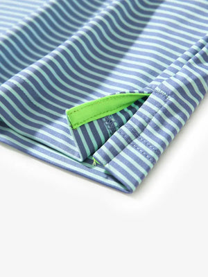 Detailed view of side hem slit on Cooling Stripe Golf Shirt in GREEN ASH STRIPE, showing comfort and design