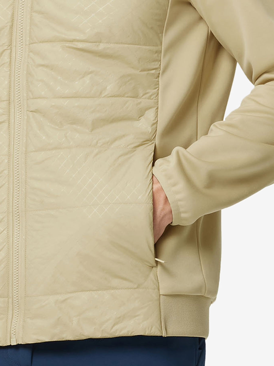 Hand in single pocket detail of the Light Khaki Golf Fleece Winter Jacket, soft thermal material.