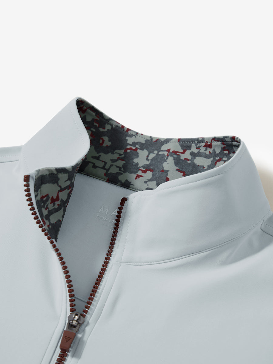 Zipper and inner pattern detail of the print collar quarter zip golf vest in misty grey, highlighting design.