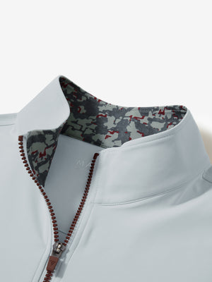 Zipper and inner pattern detail of the print collar quarter zip golf vest in misty grey, highlighting design.