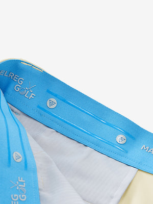 Inside waistband detail of water-resistant golf stretch nylon pants featuring maelreg logo, beige.