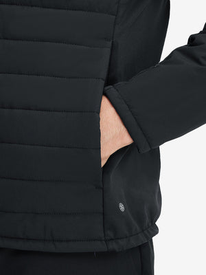 Detail view of outer pocket on black warm puffer winter golf jacket