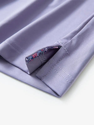 Close-up of side slit detail on the Lavender Everyday Classic Solid Polo hem