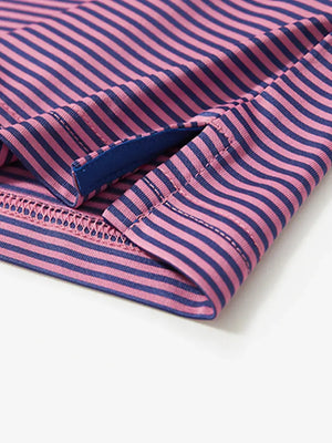 Detailed view of side hem slit on Cooling Stripe Golf Shirt in PINK BLUE STRIPE, showing comfort and design