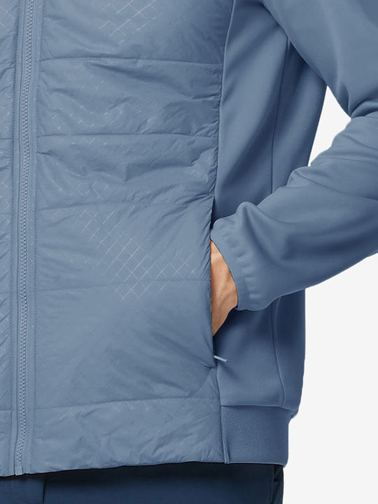 Hand in single pocket detail of the Shadow Blue Golf Fleece Winter Jacket, soft thermal material.