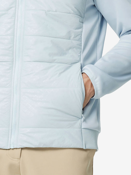 Hand in single pocket detail of the Glacier Grey Golf Fleece Winter Jacket, soft thermal material.