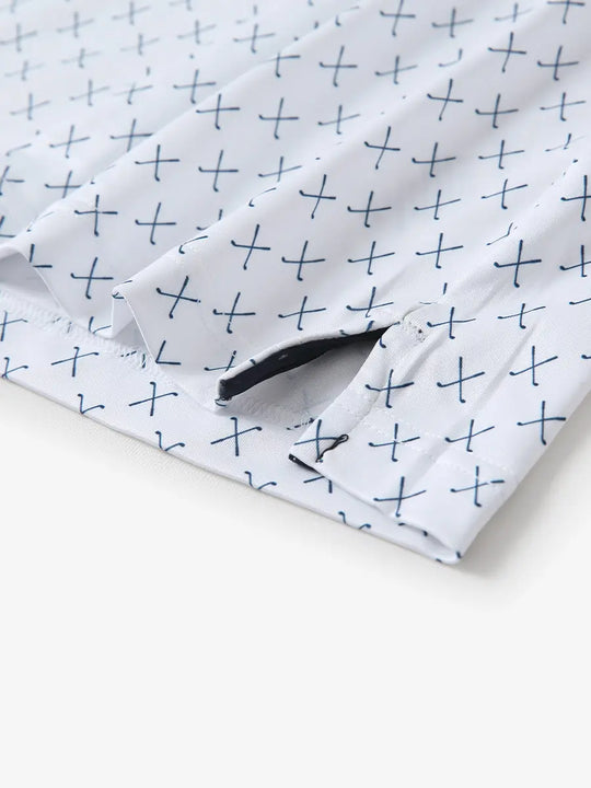 Hem slit detail of WHITE NAV CLUE Performance Quick Dry Print Golf Polo highlighting stitching and finish