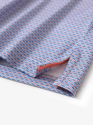 Hem slit detail of MAELREG Performance Jersey Print Polo in Blue White Oval – comfort & movement