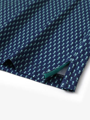 Hem slit detail of MAELREG Performance Jersey Print Polo in Green Seahorse – comfort & movement