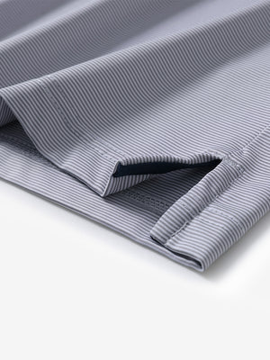 Hem detail of Long sleeve pinstripe jersey polo with neat finish in navy stripe