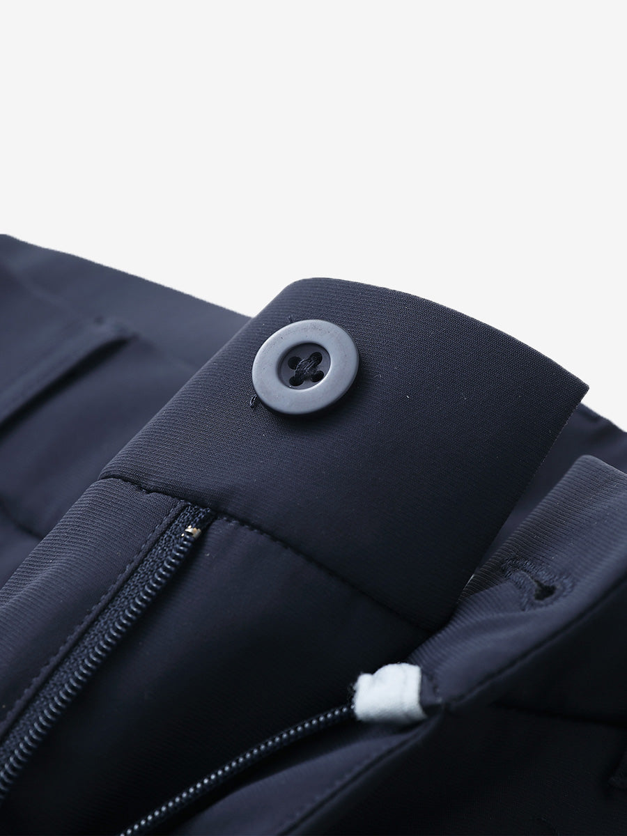 Waist detail of quick dry casual dress pants in navy, featuring button and zipper design.