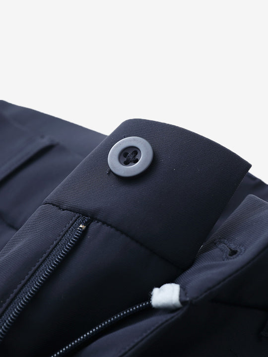 Waist detail of quick dry casual dress pants in navy, featuring button and zipper design.