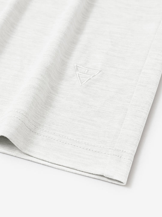 Hem detail of Men’s Long Sleeve Mock Turtleneck Shirt in White, showcasing smooth finish.