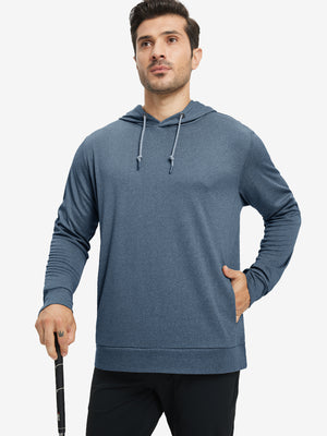 Model with one hand in pocket, wearing classic heather pullover hoodie in navy melange, relaxed look.