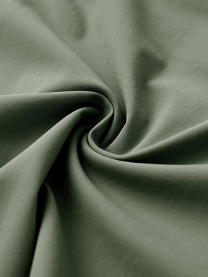 Close-up of quick dry casual shorts with 4 pockets fabric, breathable olive green texture with smooth finish