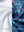 Close-up of the inner and outer fabric of youth full print stylish hoodies pullover in navy colorful flower, showing texture and finish