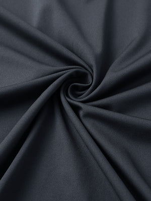 Close-up of blackdark grey premium performance polo fabric showing smooth texture.