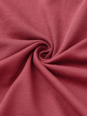 Fabric close-up of rose cotton blend pique plain shirt, breathable pique fabric texture.