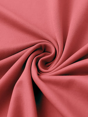 Close-up of fabric on stylish chest print snap polo, showing texture and finish in cranberry.