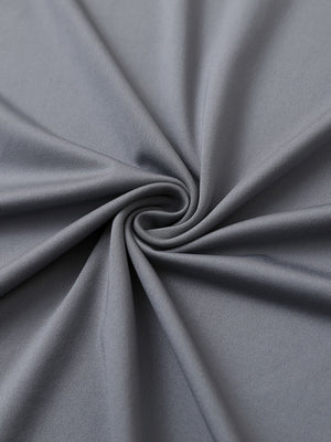 Close-up of light grey chest print polo shirt fabric showing smooth texture and crisp graphic application area.