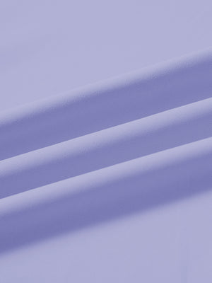 Fabric close-up of print collar quarter zip golf vest, smooth material with subtle texture in lavender