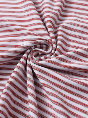Close-up of brick white unique watercolour stripe polo fabric showing soft, blended stripes and smooth texture.