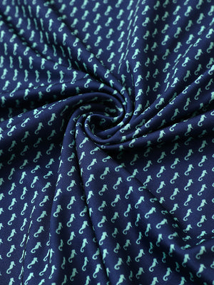 Fabric close-up of Everyday performance print polo with lightweight texture in green seahorse