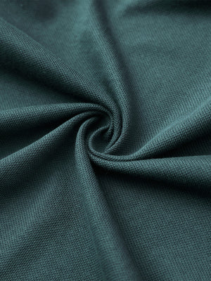 Fabric close-up of sea moss cotton blend pique plain shirt, breathable pique fabric texture.