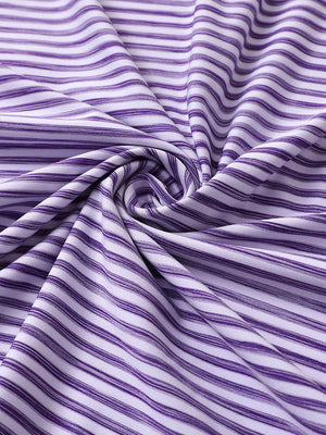 Close-up of purple white unique watercolour stripe polo fabric showing soft, blended stripes and smooth texture.